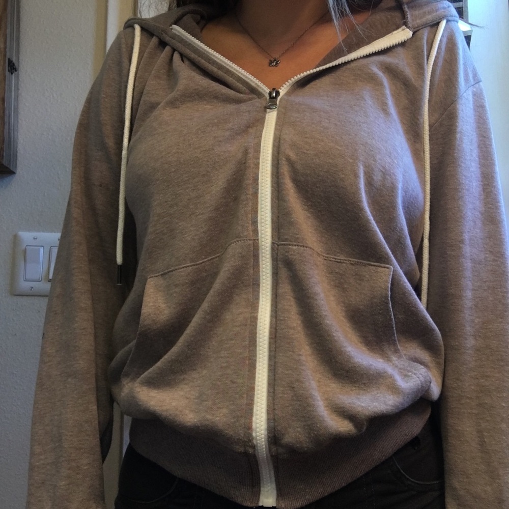 beige thin zip up hoddie with white drawstrings